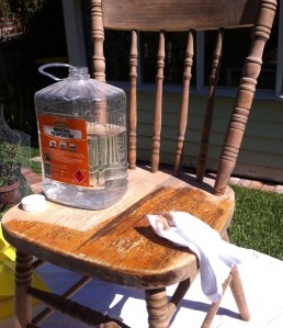 wiping the bare wood with turps