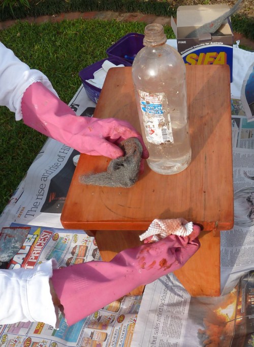 wiping over the wood after cleaning with metho